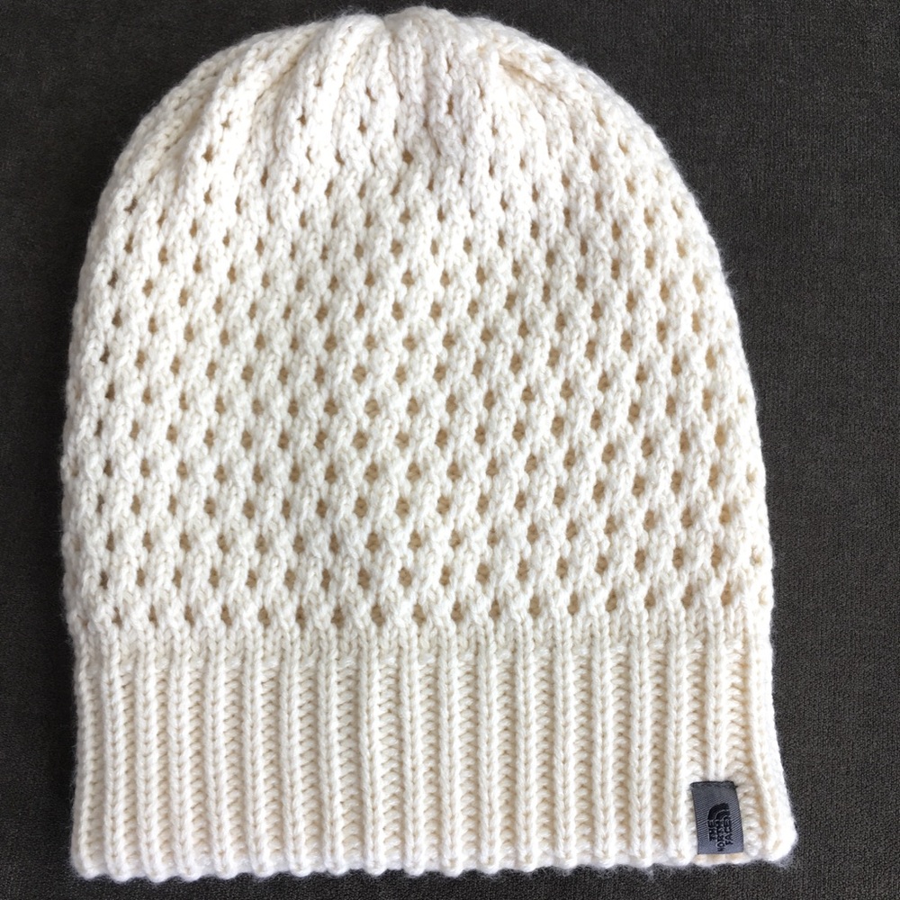 Cream North Face beanie.
